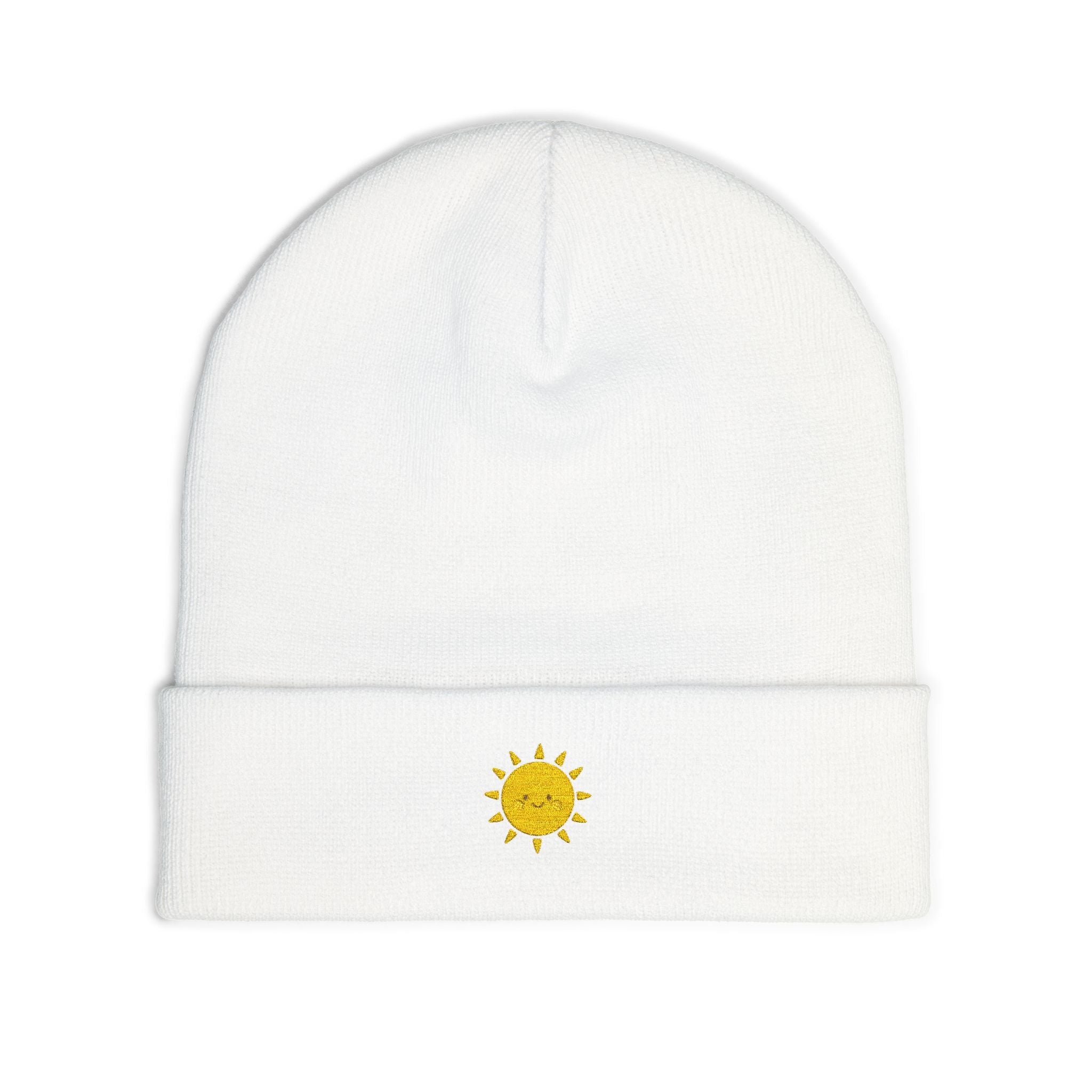 White beanie with a yellow sun design on a white background
